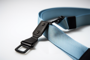 camera strap, blue nylon webbing, black ring