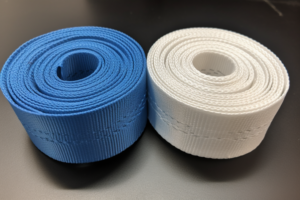 white, blue nylon webbing rolls