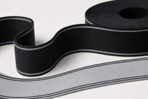High-stretch elastic waistband webbing shown in black and gray woven constructions.