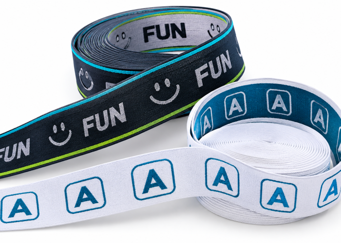Custom jacquard elastic waistband webbing with woven A logos and FUN lettering.