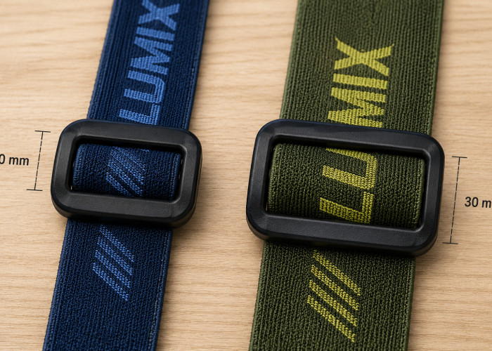Elastic headlamp strap webbing in different widths threaded through plastic adjusters