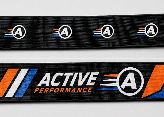 Small and large multicolor screen print coverage compared on black woven webbing.